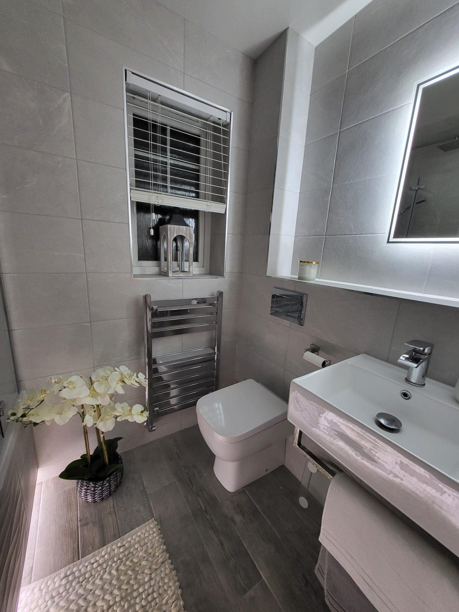 Modern grey tiled bathroom