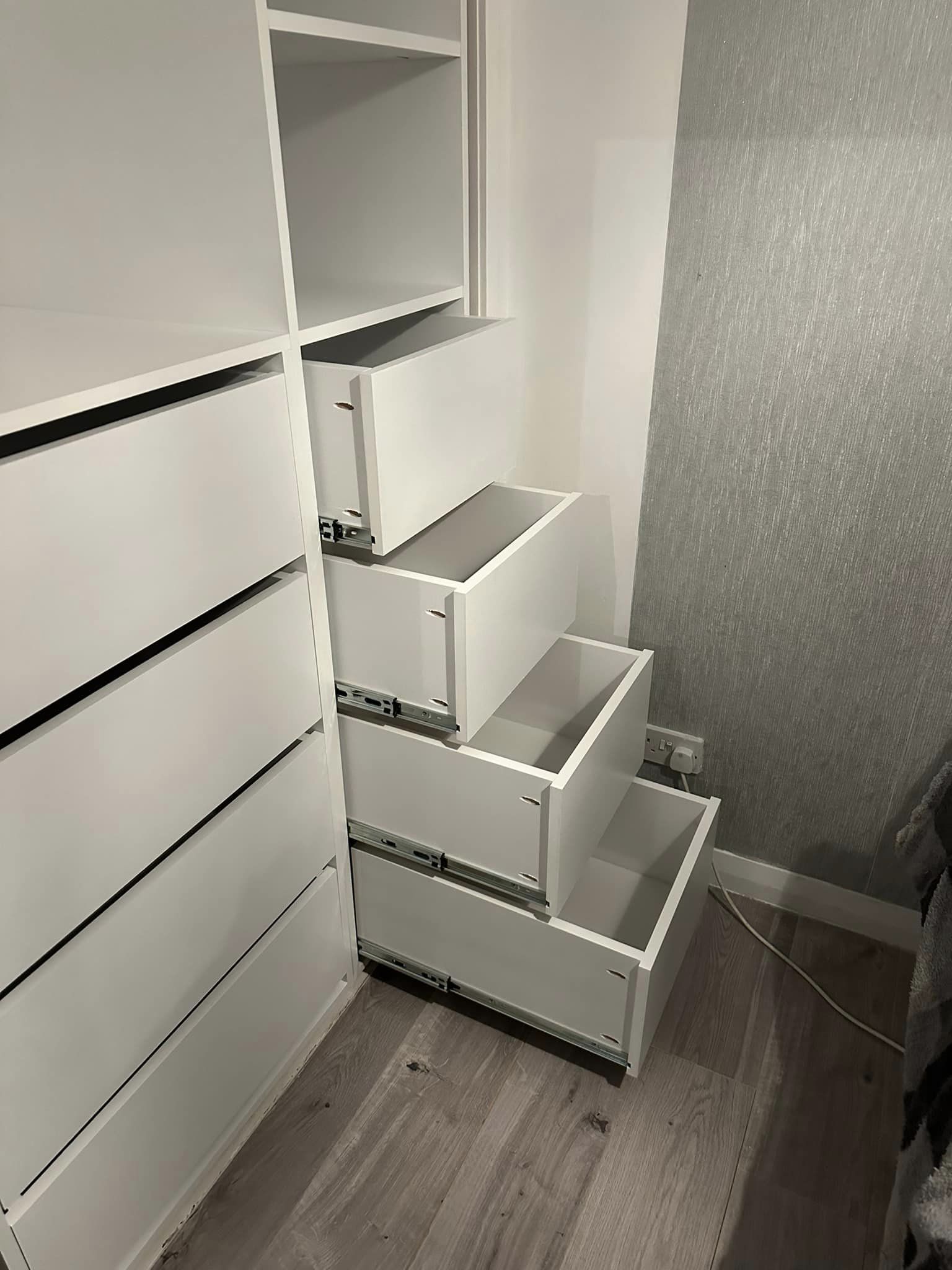 Pull out drawers of a fitted wardrobe