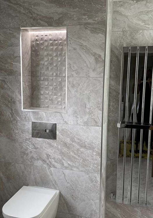 Modern vertical radiator in a bathroom