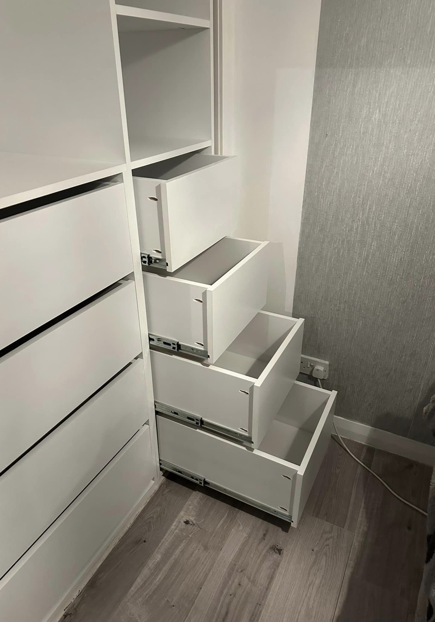 Pull out drawers of a fitted wardrobe